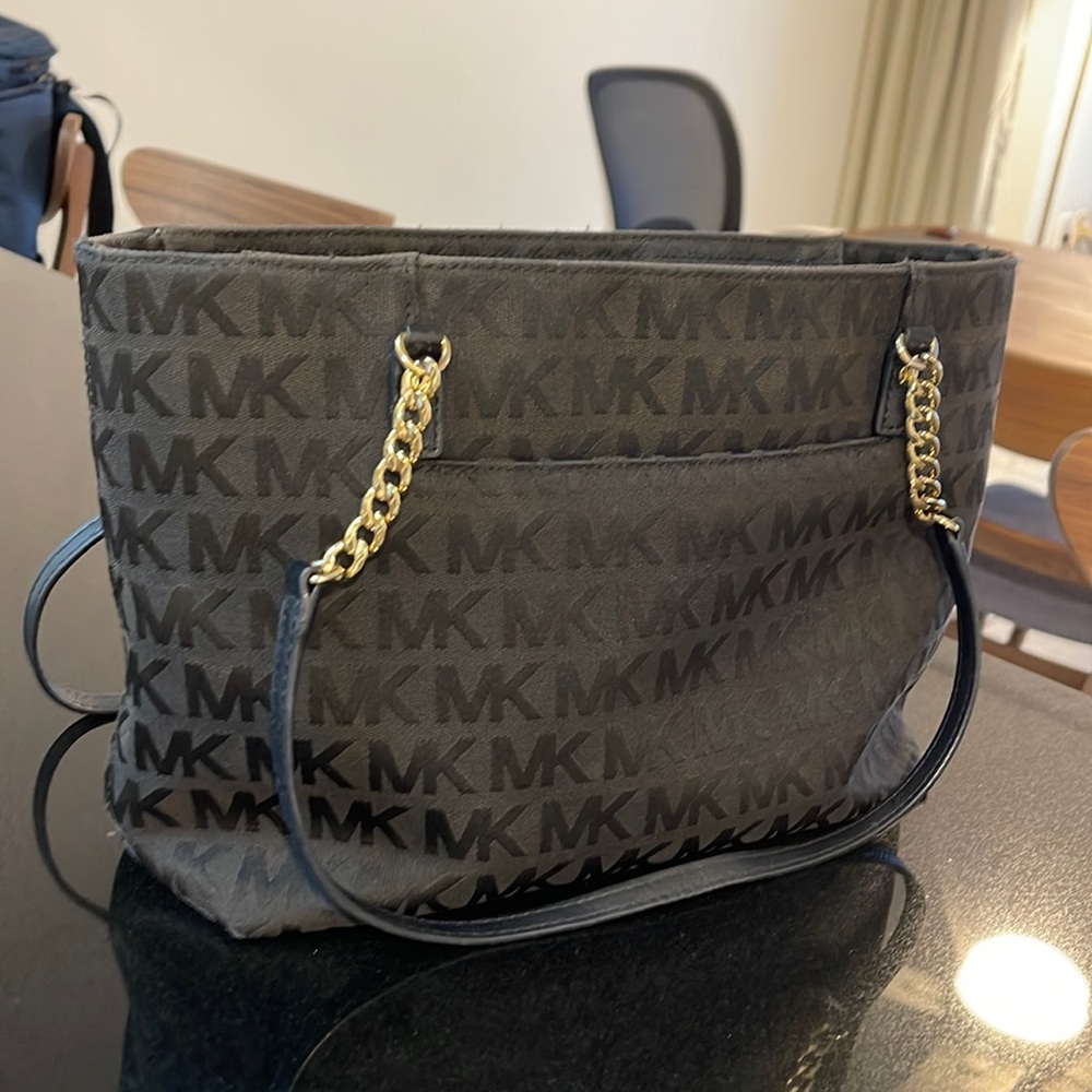 Michael Kors black MK purse with gold handles